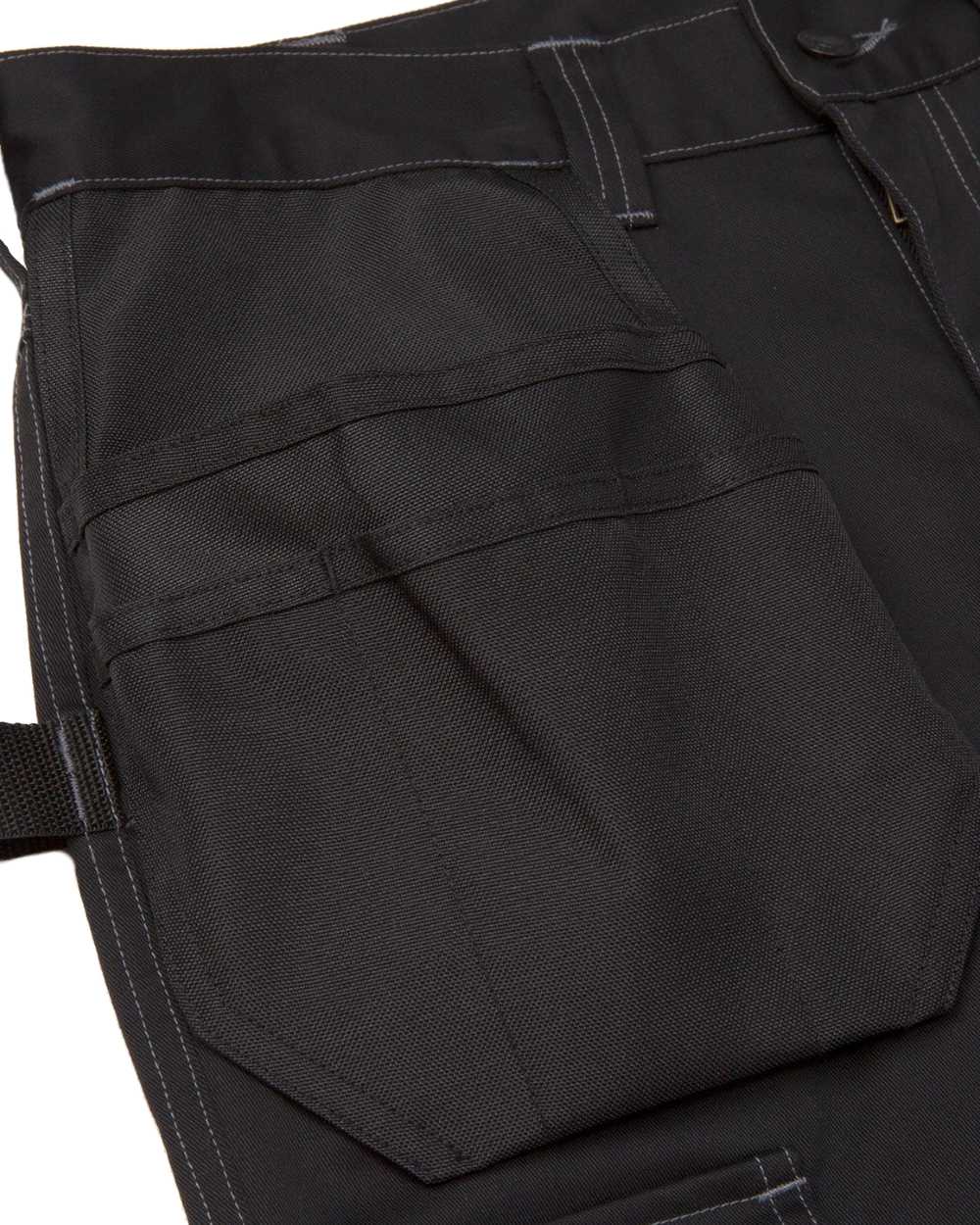 Black Coloured Caterpillar Essential Knee Pocket Stretch Holster Trousers on White Background
