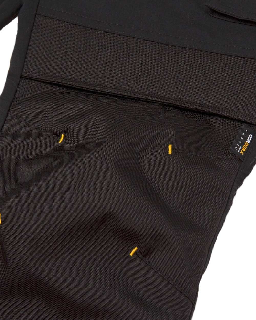 Black Coloured Caterpillar Mens Nexus Knee Pocket Stretch Trousers on White Trousers
