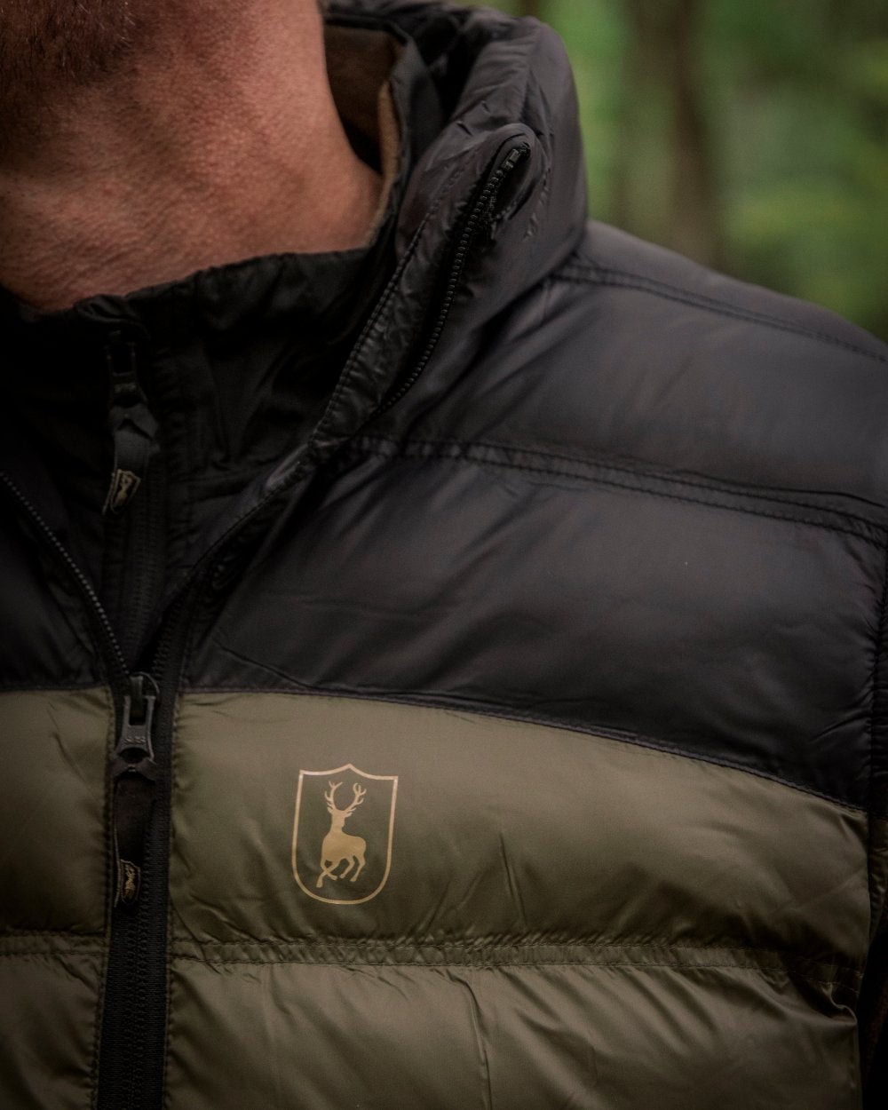Rifle Green coloured Deerhunter Northward Padded Waistcoat on Forest background 