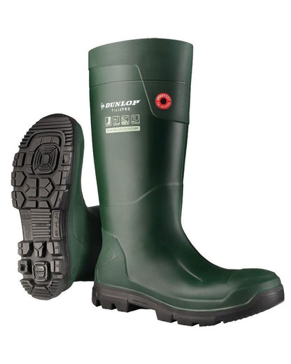 Green coloured Dunlop FieldPro Wellingtons on white background 