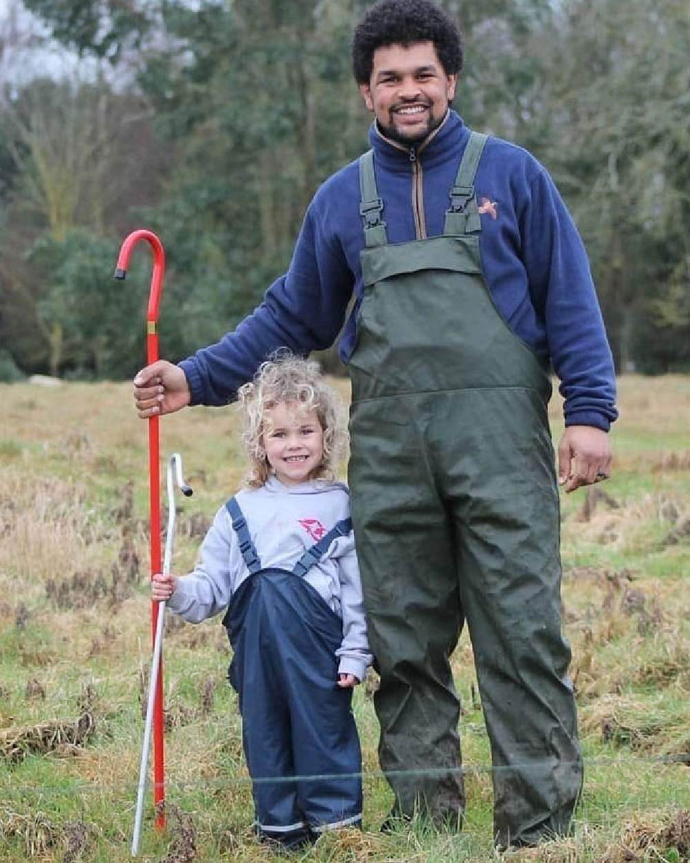 Navy Coloured Fort Childrens Splashflex Bib and Brace On A Field Background 