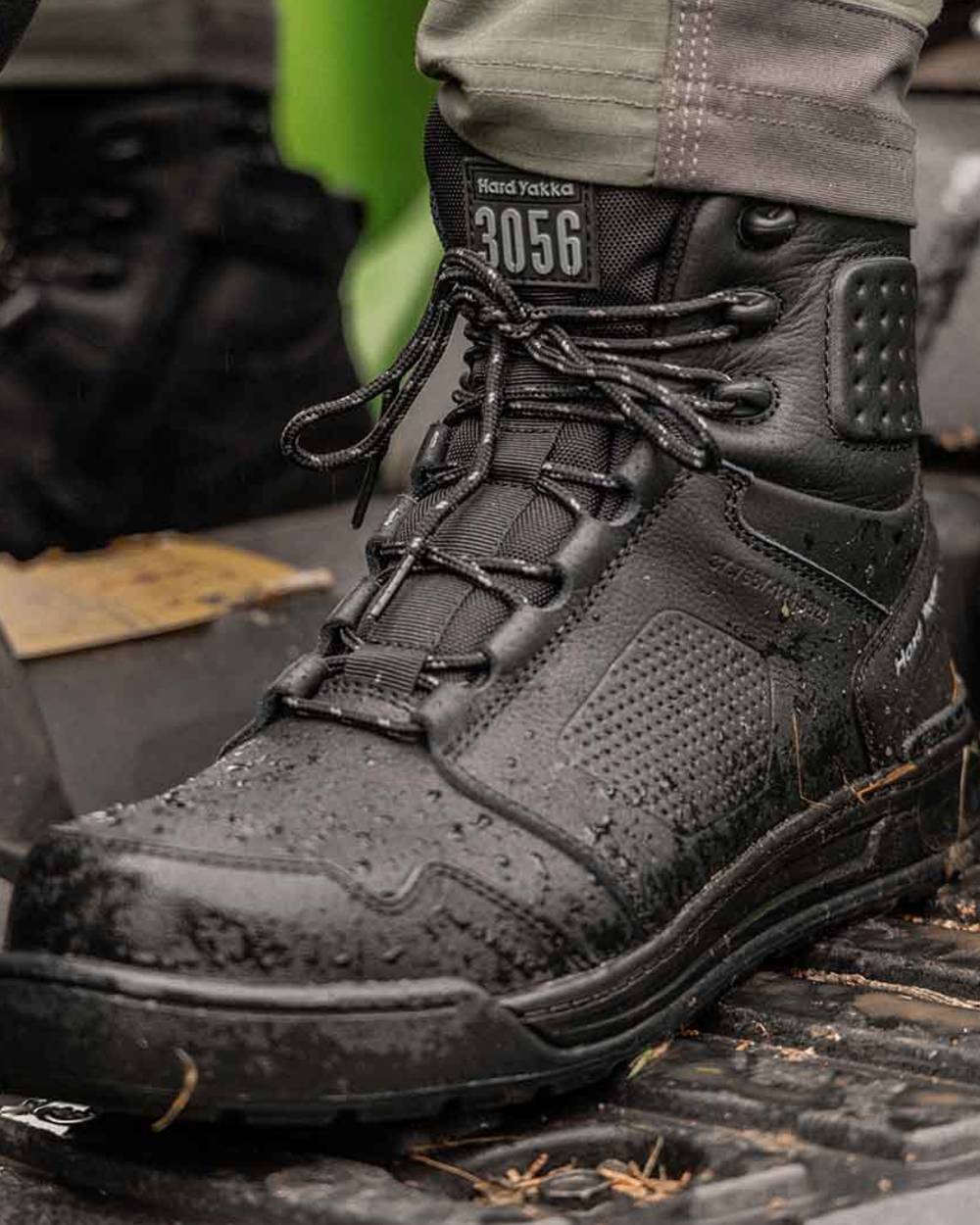 Black Coloured Hard Yakka Mens 3056 S7S 6 Safety Boots on Outddor Background
