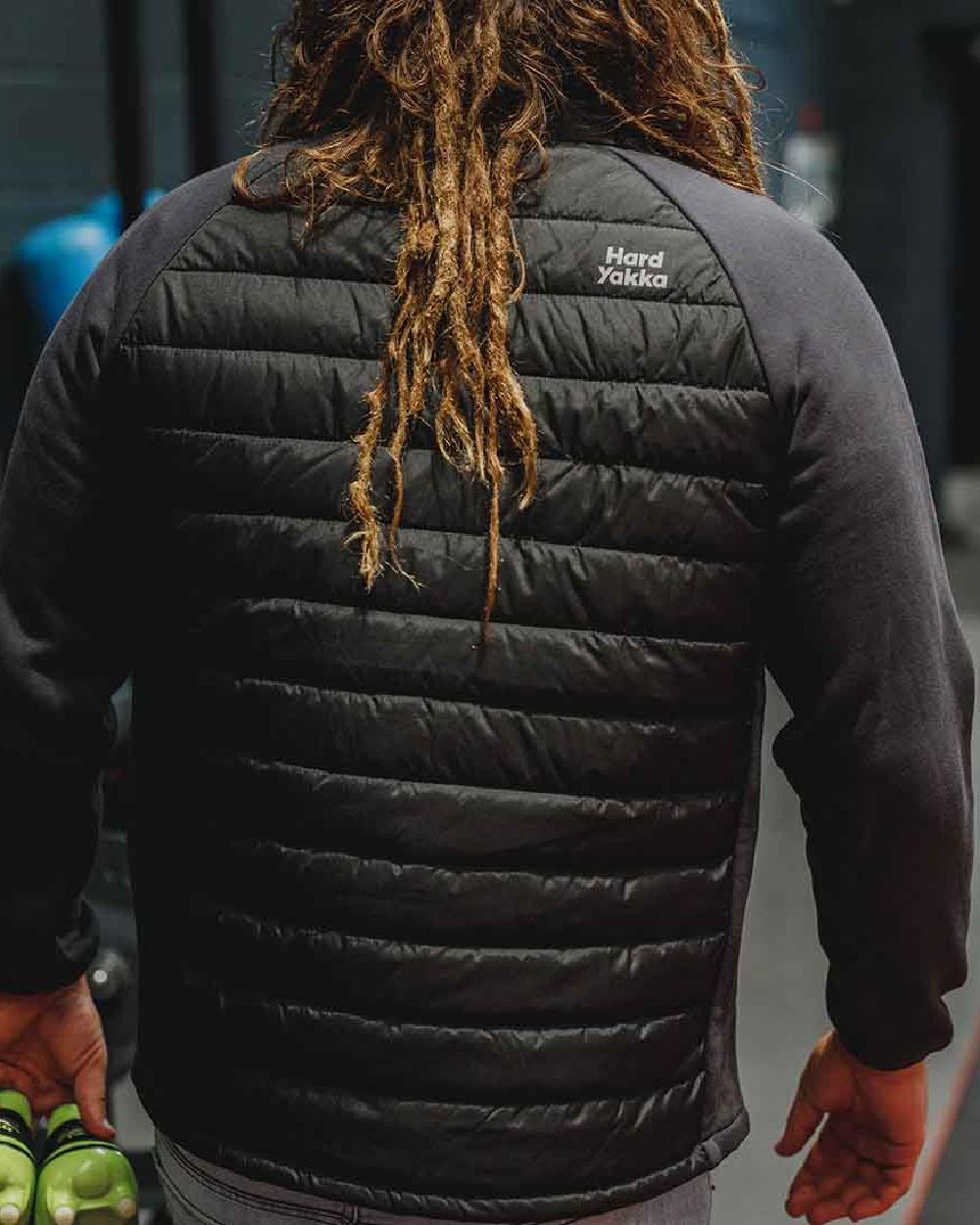 Black Coloured Hard Yakka Mens Apex Hybrid Jacket on Indoor Background
