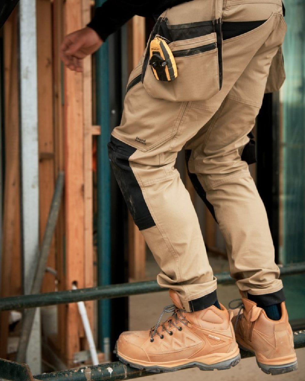 Wheat Coloured Hard Yakka Mens Atomic PR Hybrid Side Zip Safety Boots on Construction Background
