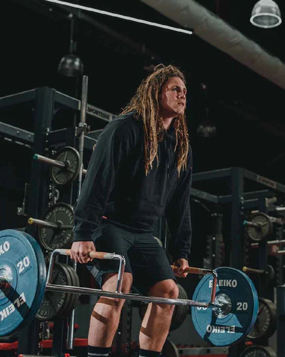 Navy Coloured Hard Yakka Mens Brushed Fleece Hoodie on Gym Background
