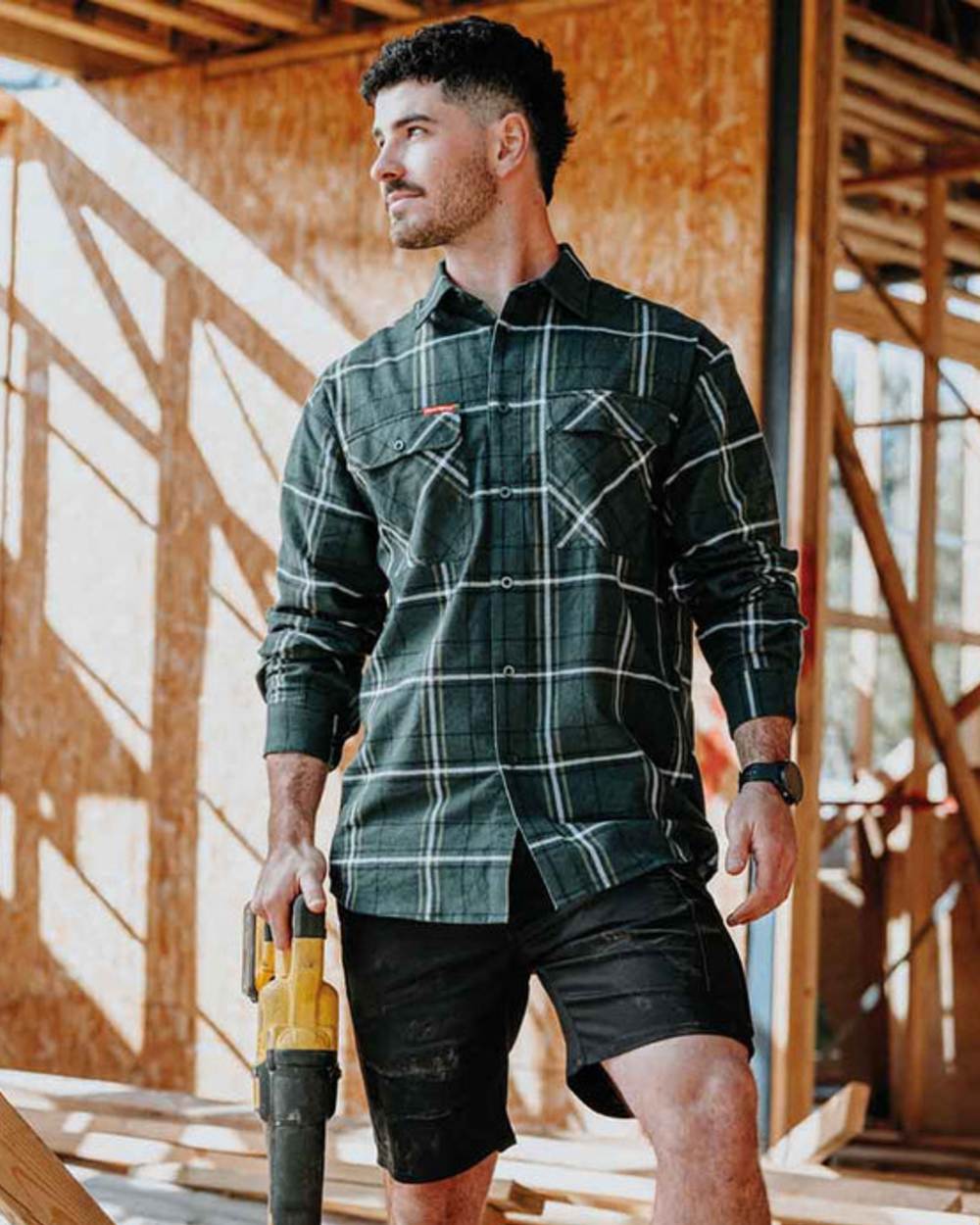 Green Coloured Hard Yakka Mens Lightweight Check Flannel Shirt on Construction Background
