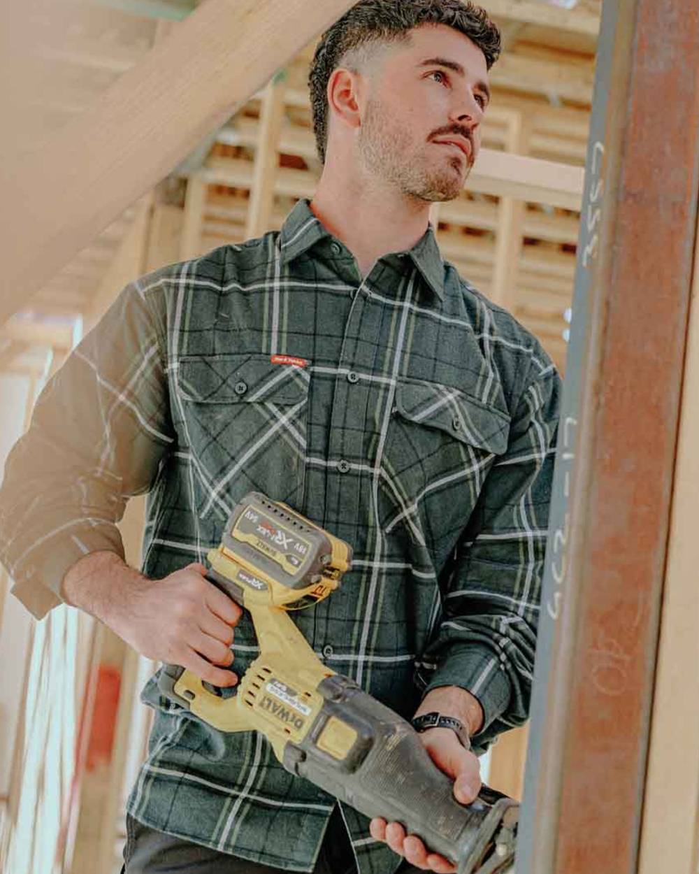 Green Coloured Hard Yakka Mens Lightweight Check Flannel Shirt on Construction Background
