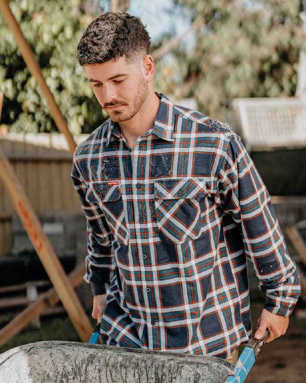 Navy Coloured Hard Yakka Mens Lightweight Check Flannel Shirt on Construction Background
