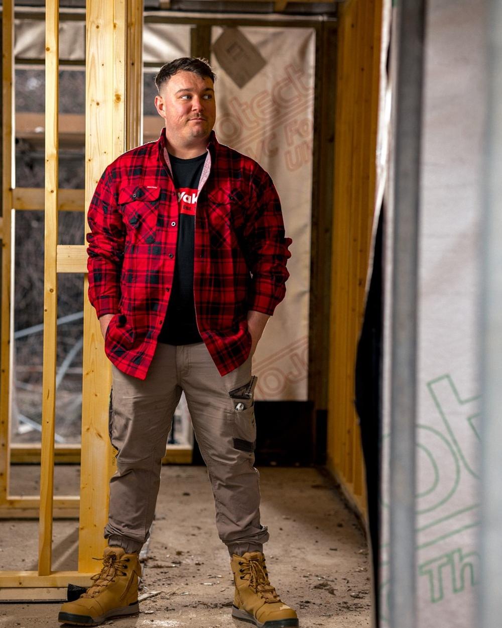 Red Coloured Hard Yakka Mens Lightweight Check Flannel Shirt on Construction Background
