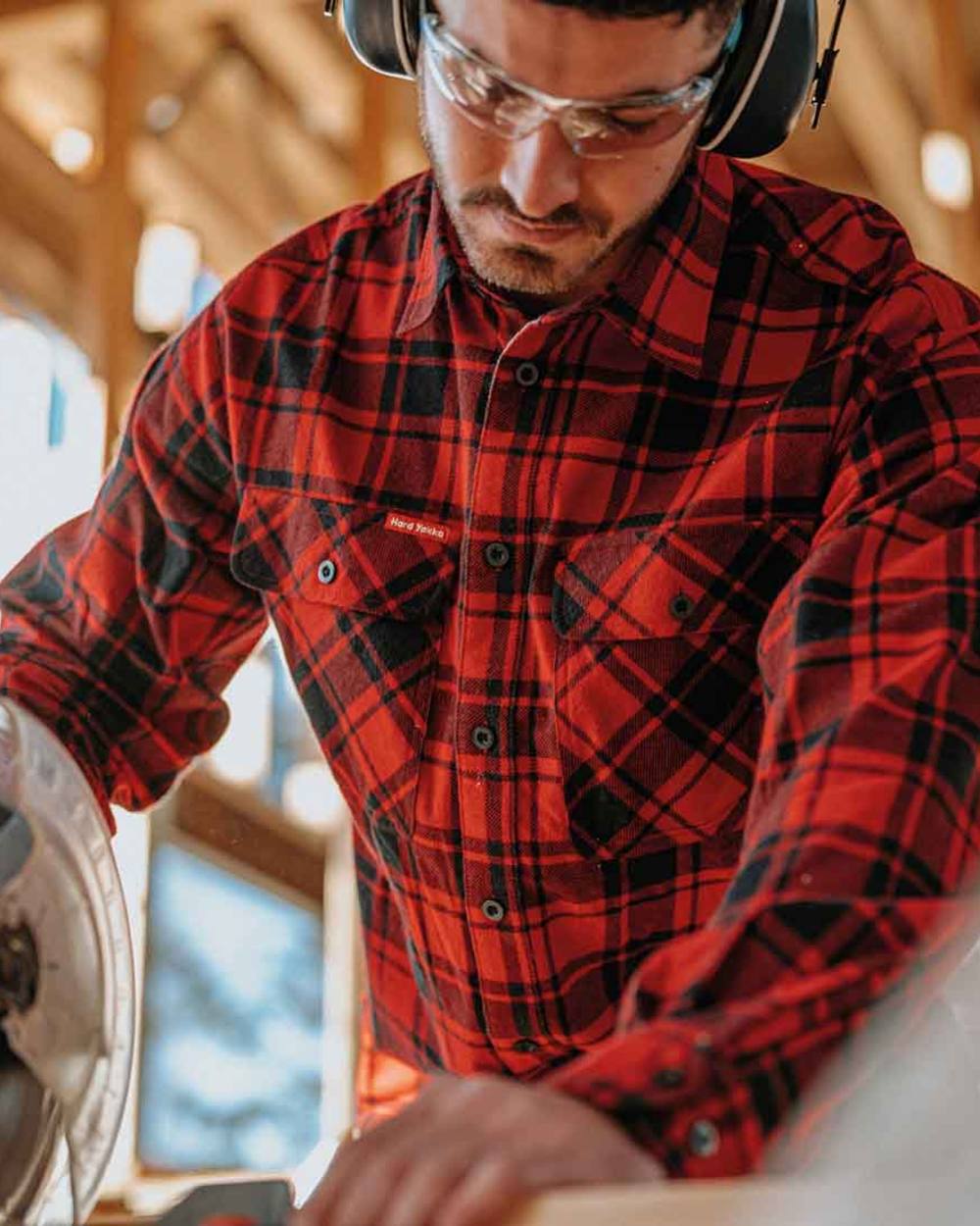 Red Coloured Hard Yakka Mens Lightweight Check Flannel Shirt on Construction Background
