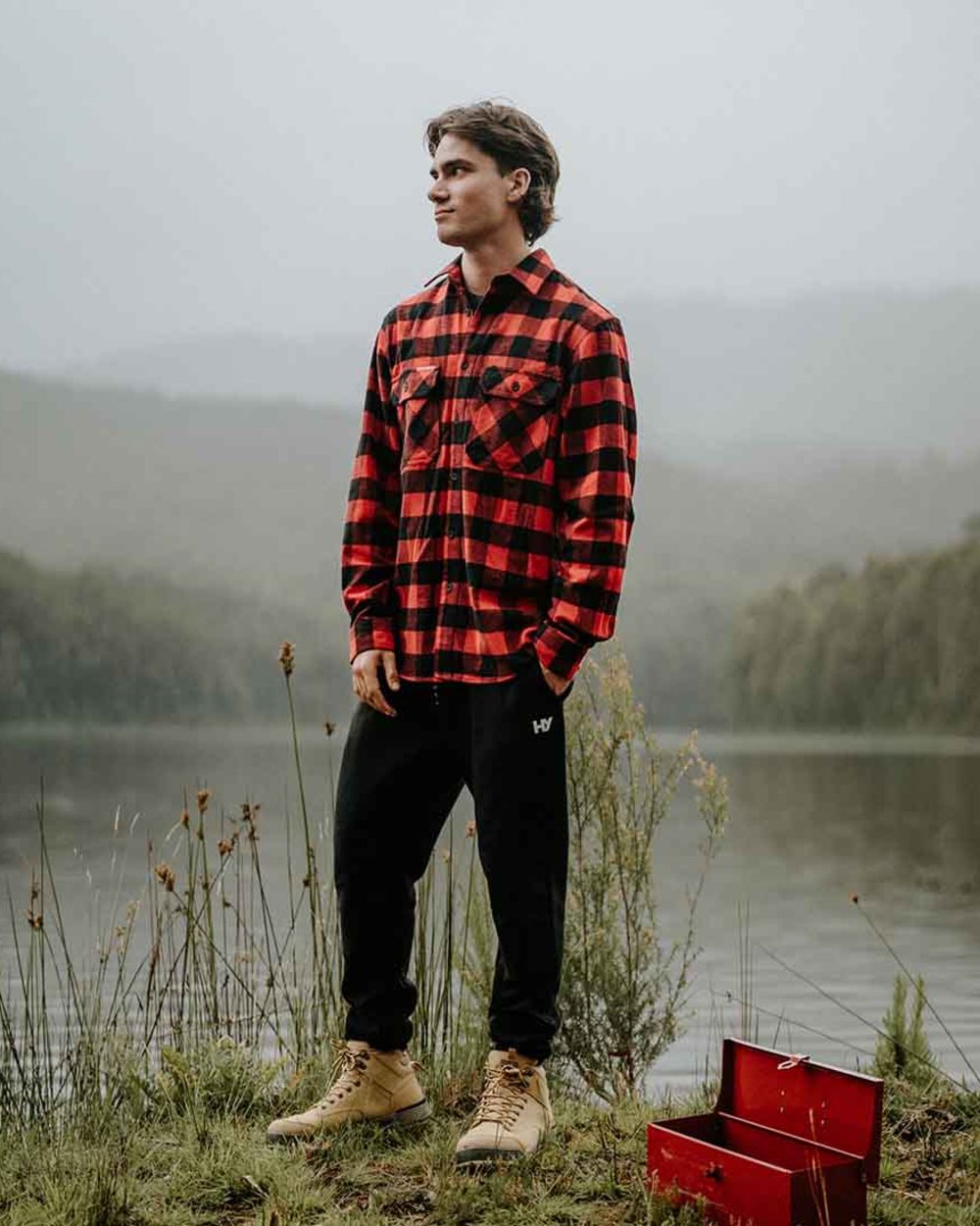 Red Coloured Hard Yakka Mens Long Sleeve Check Flannel Shirt on River Background
