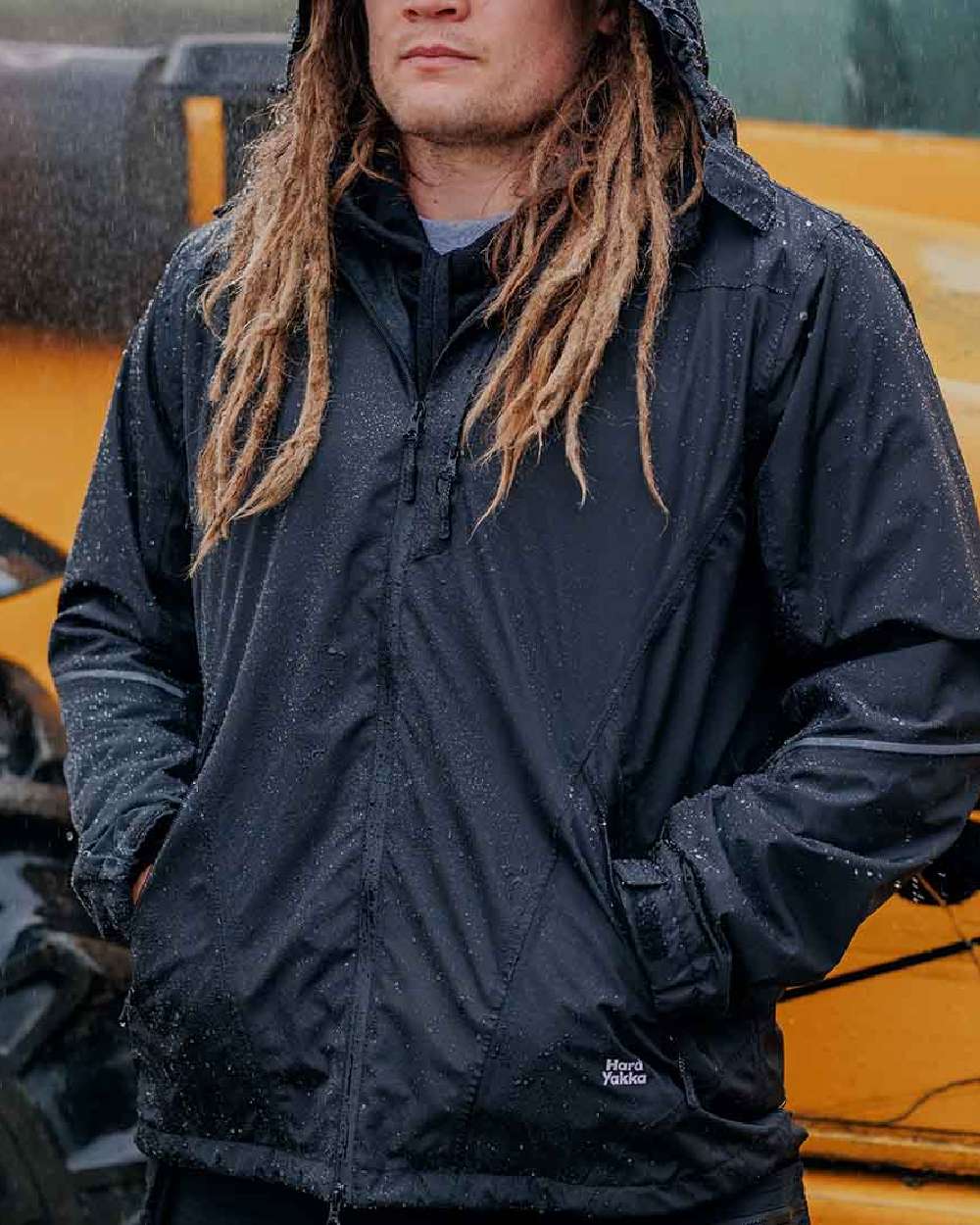 Black Coloured Hard Yakka Mens Orbit Waterproof Jacket on Outdoor Background