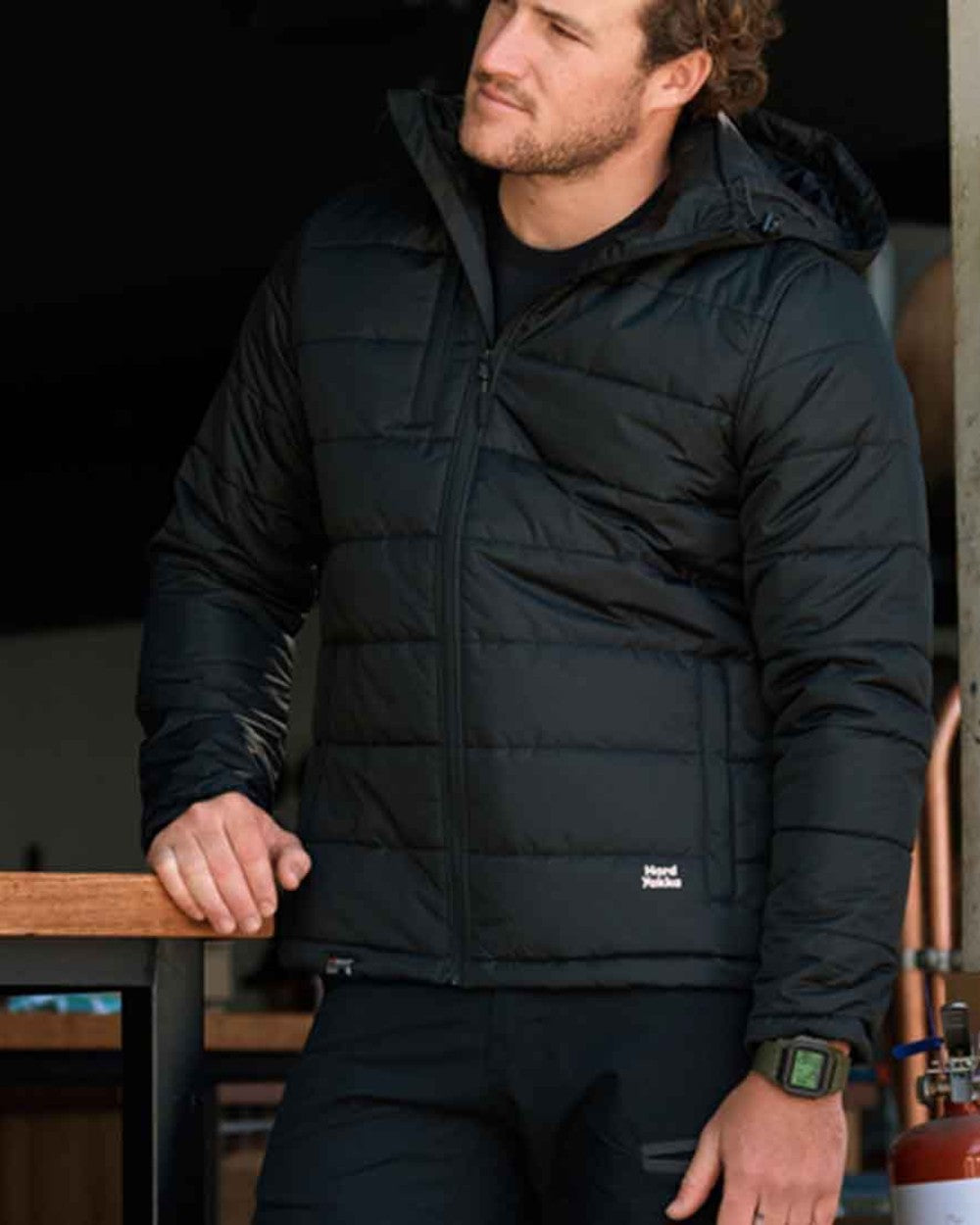 Black Coloured Hard Yakka Mens Puffa 2.0 Insulated Jacket on Indoor Background
