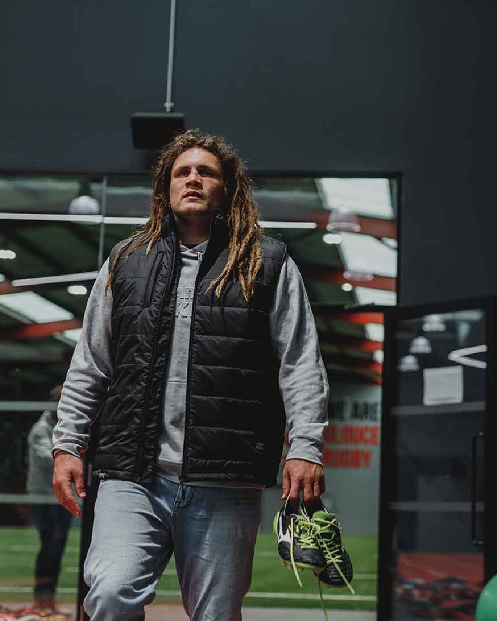 Black Coloured Hard Yakka Mens Puffa 2.0 Gilet on Indoor Background
