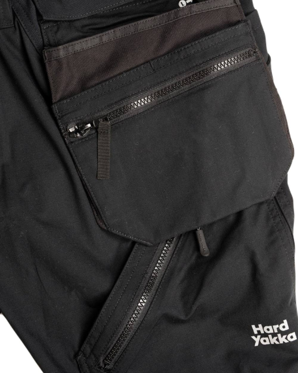 Black Coloured Hard Yakka Mens Raptor Active Cuffed Trousers on White Background
