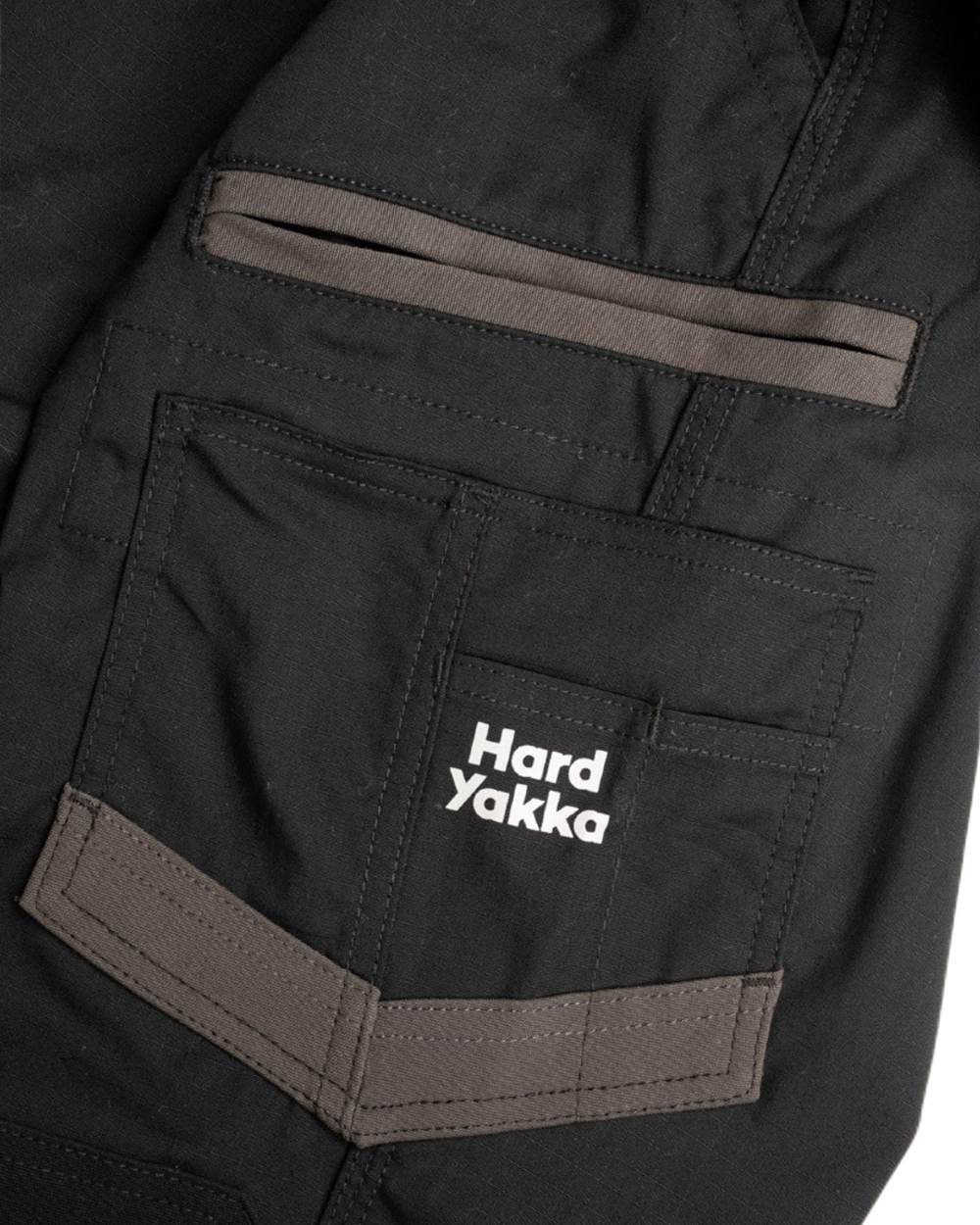 Black Coloured Hard Yakka Mens Raptor Active Cuffed Trousers on White Background

