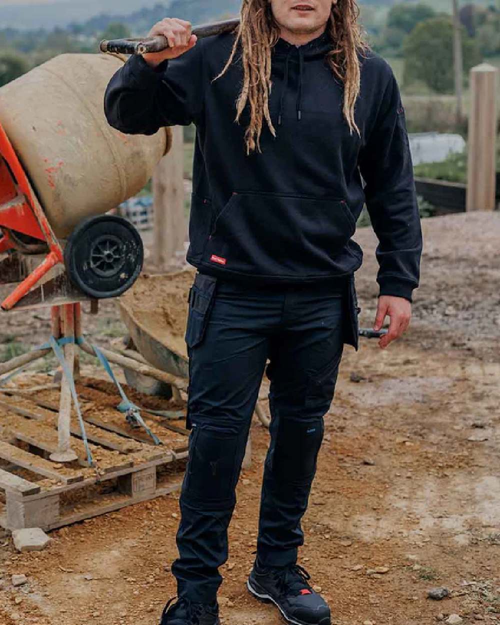 Black Coloured Hard Yakka Xtreme 2.0 Trousers on Construction Background
