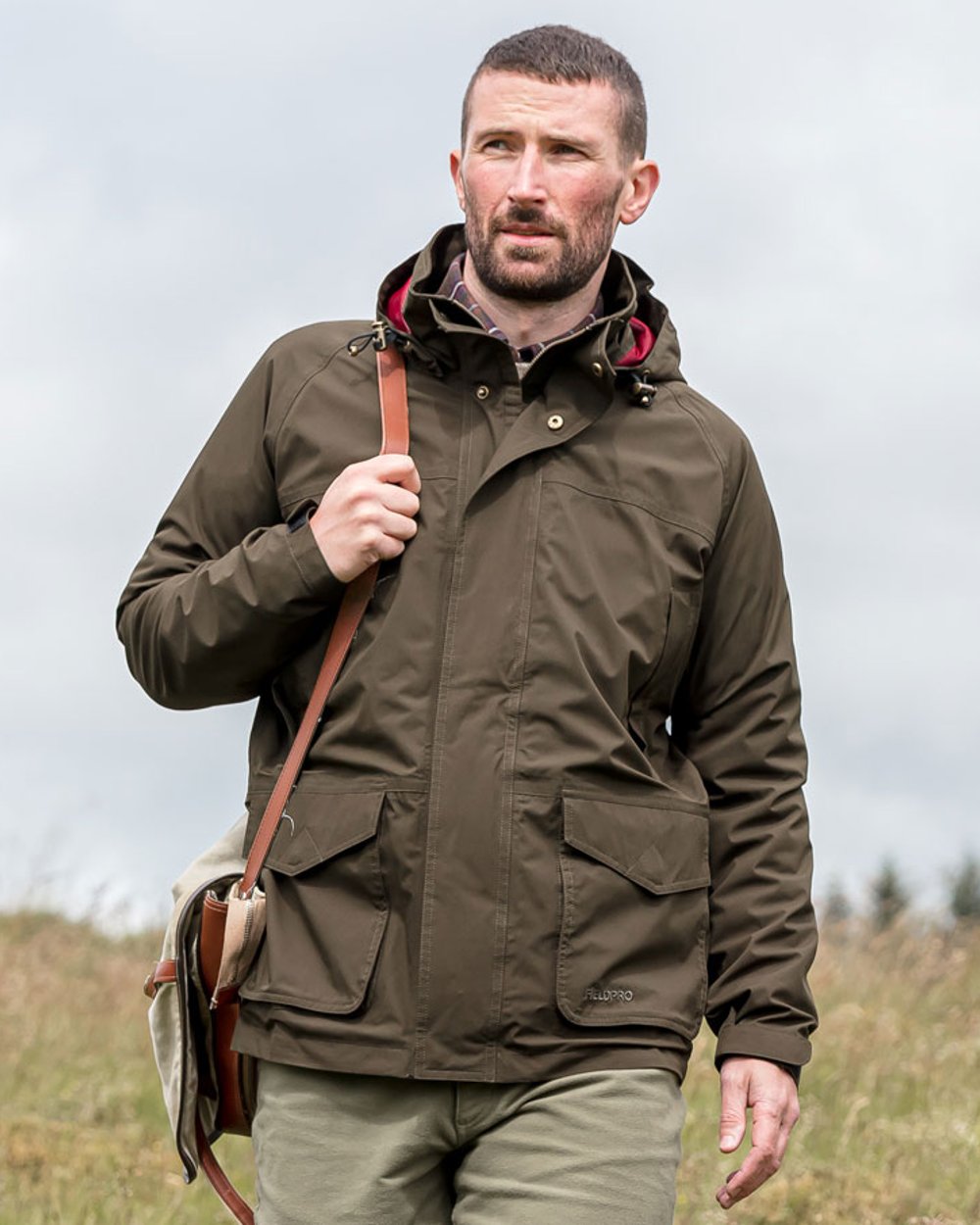 Fern Green coloured Hoggs of Fife Culloden Waterproof Field Jacket on field background 
