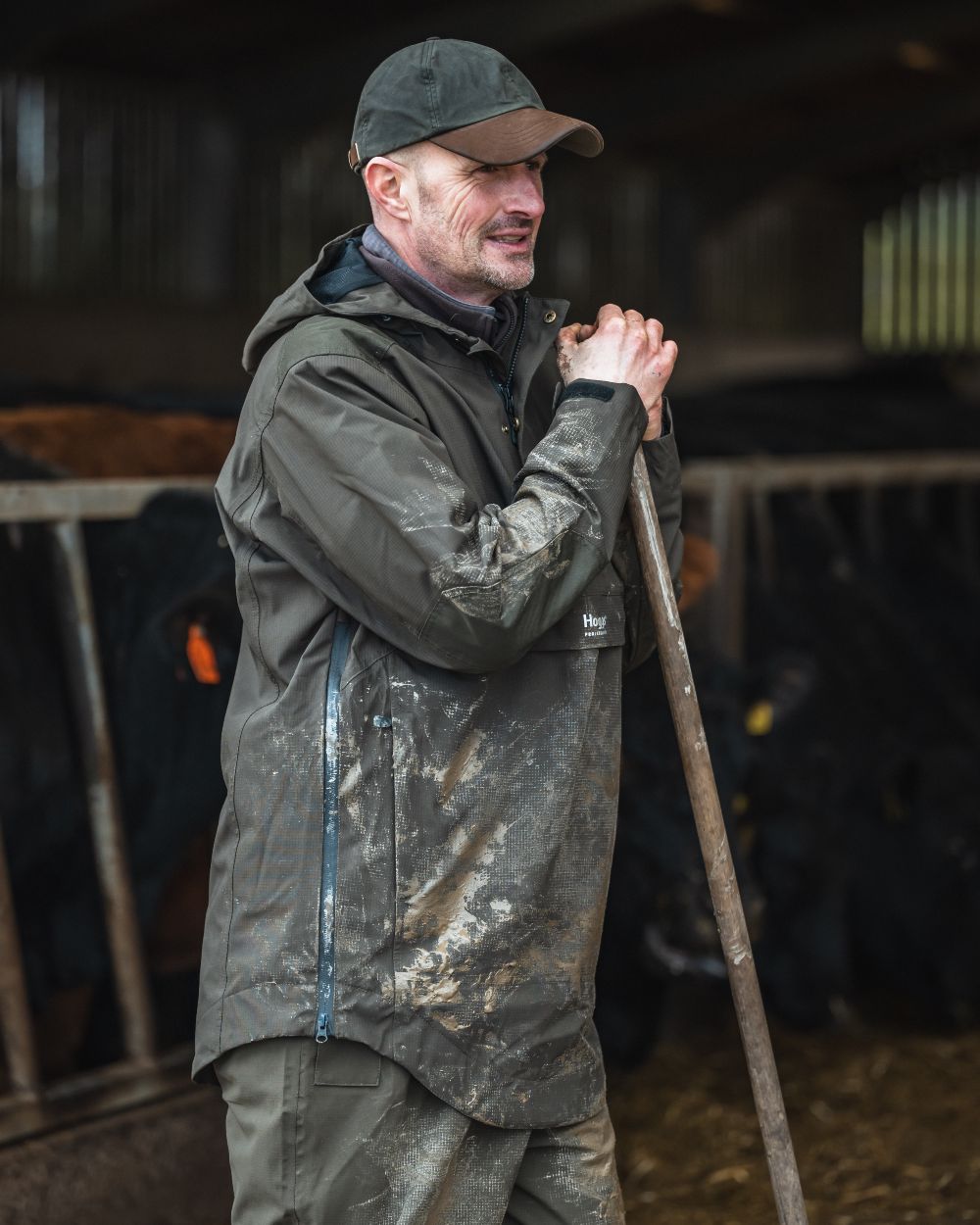 Green coloured Hoggs of Fife Green King II Waterproof Smock on barn background 
