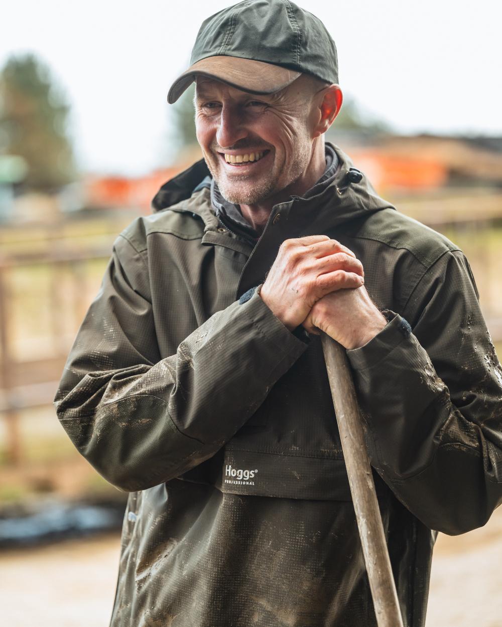 Green coloured Hoggs of Fife Green King II Waterproof Smock on barn background 