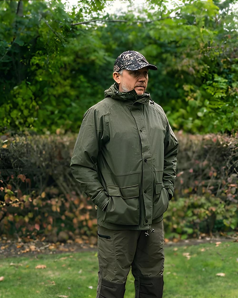 Green coloured Jack Pyke Rannock Jacket on tree background 