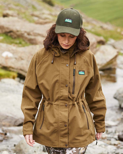 Teak Coloured Ridgeline Ladies Monsoon II Classic Jacket On A Hill Background 