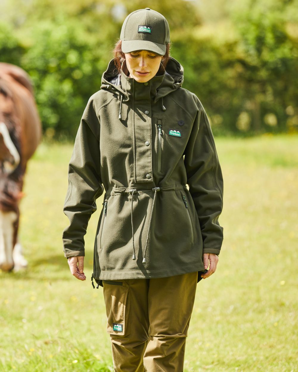 Deep Forest Coloured Ridgeline Ladies Monsoon II Waterproof Smock On A Field Background 