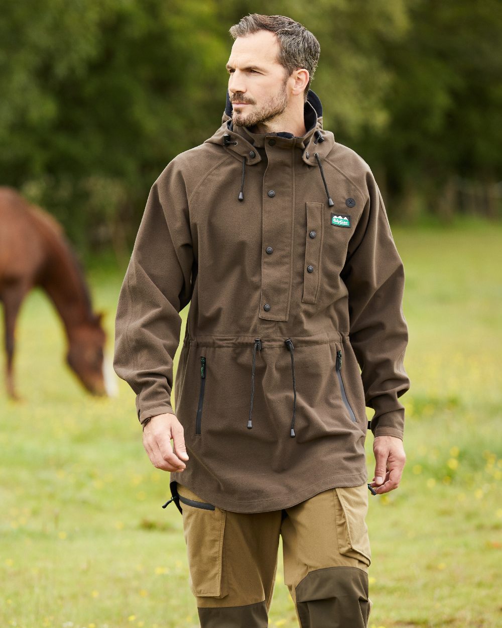 Bark coloured Ridgeline Monsoon Classic Waterproof Smock on blurry background 