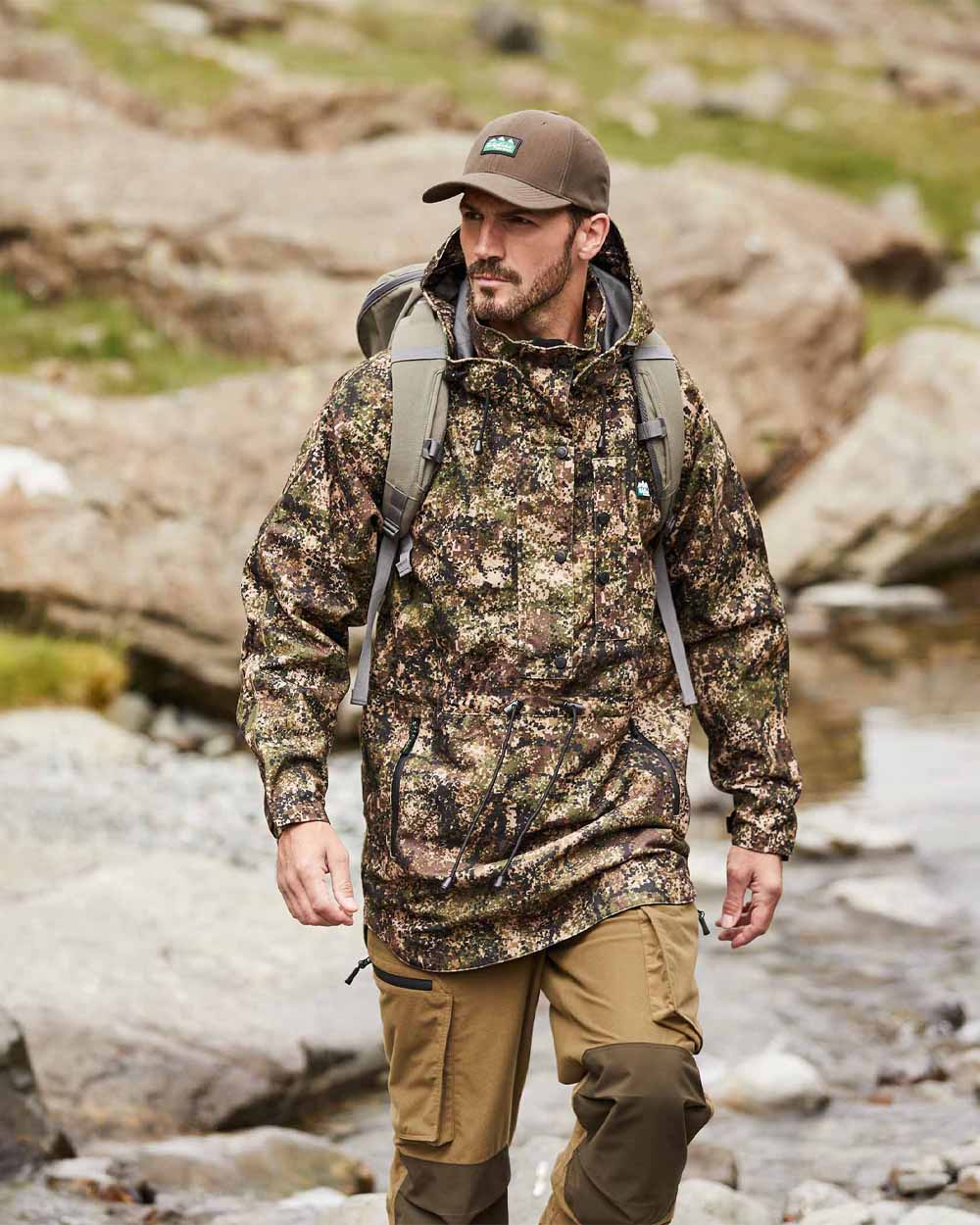 Dirt Camo coloured Ridgeline Monsoon Classic Waterproof Smock on Rocky background 