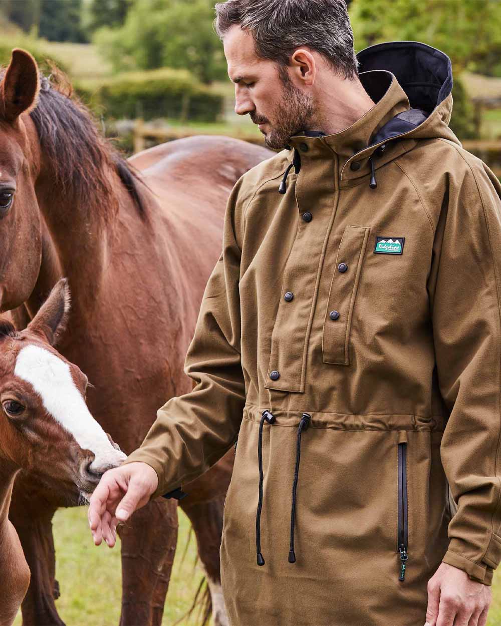 Teak coloured Ridgeline Monsoon Classic Waterproof Smock on Field background 