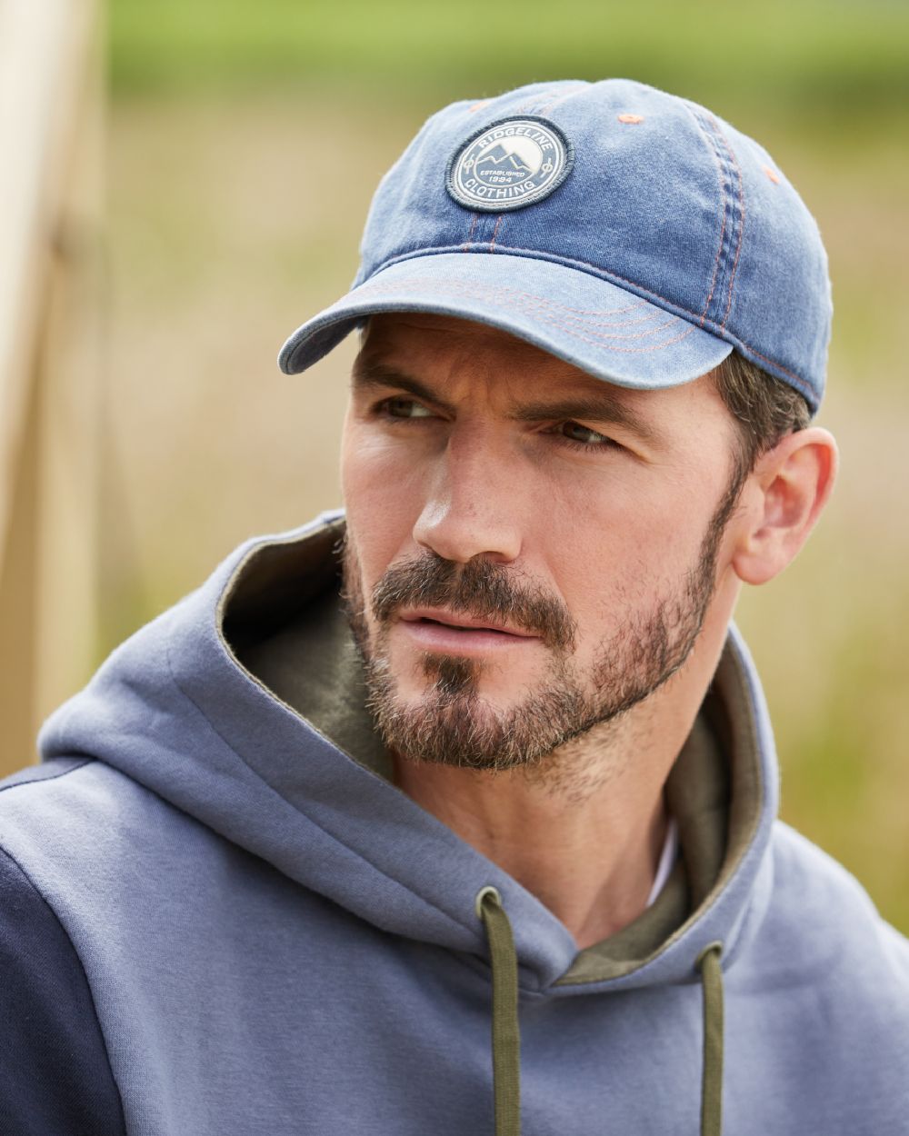 Denim Wash Coloured Ridgeline Original Truckie Cap On A Blurry Background