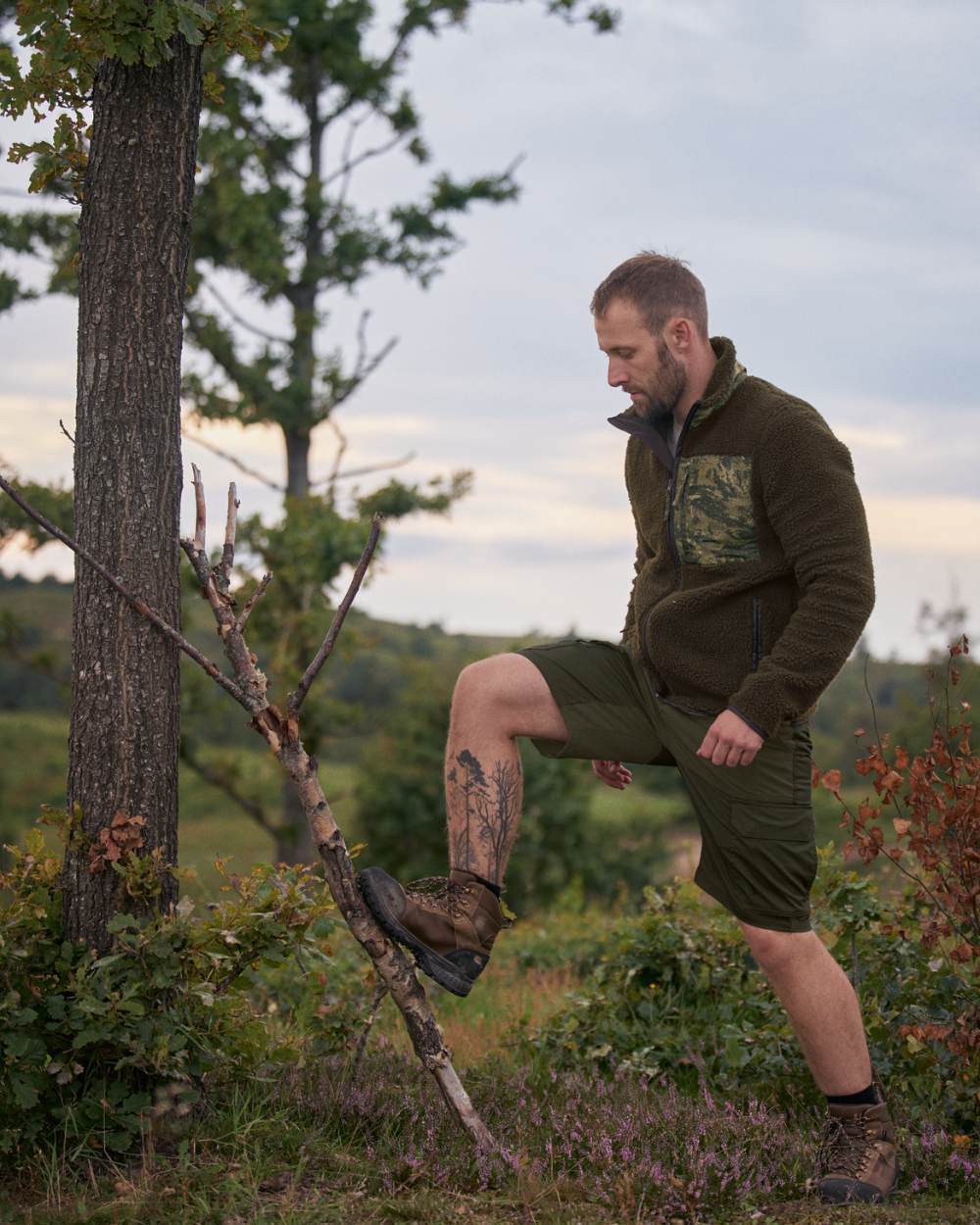 Light Pine Grizzly Brown Coloured Seeland Elm Shorts On A Forest Background