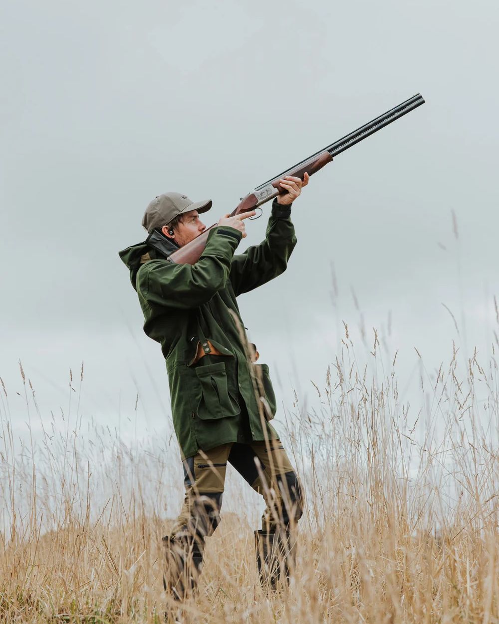 Olive Coloured Swazi Wapiti Xp Jacket On A Forest Background 