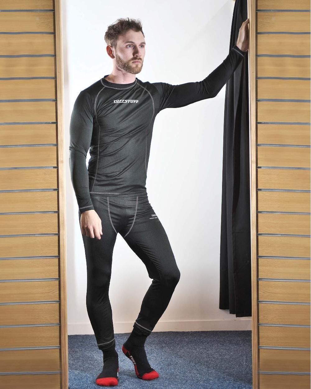 Black Coloured TuffStuff Basewear Long Sleeve T-Shirt On A Fitting Room Background
