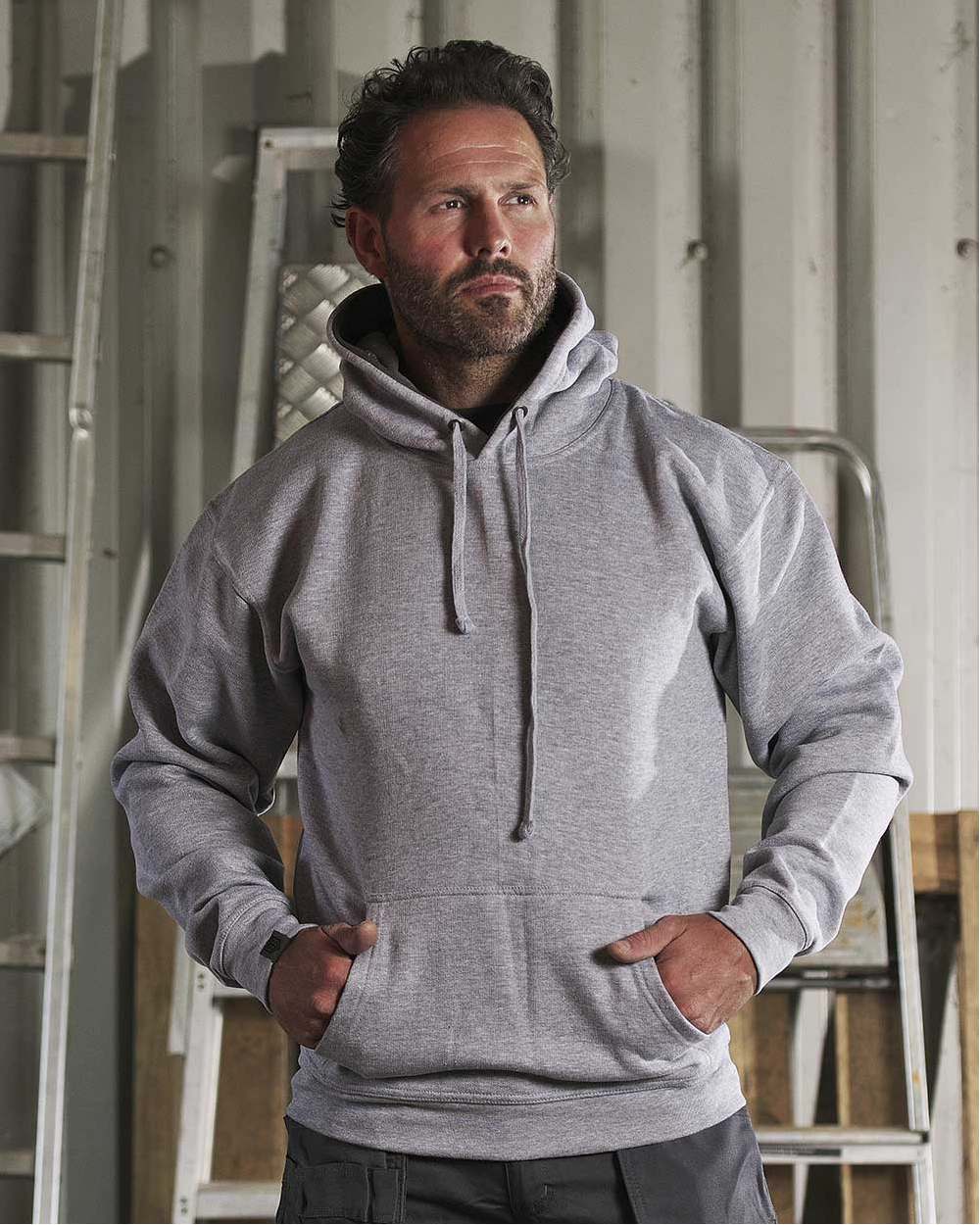Grey Coloured TuffStuff Hendon Hoodie On A Warehouse Background 
