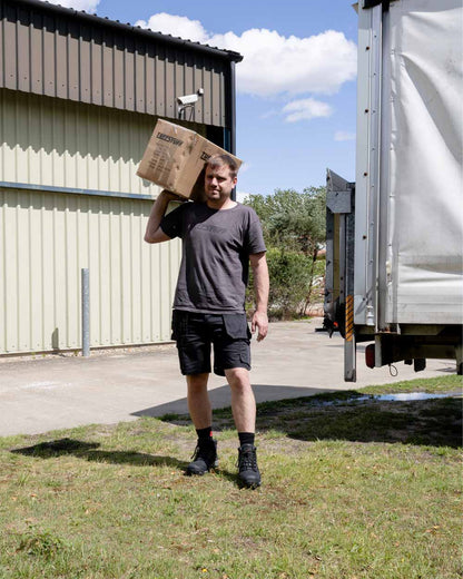 Black coloured TuffStuff Proflex Work Shorts on Model Courier 