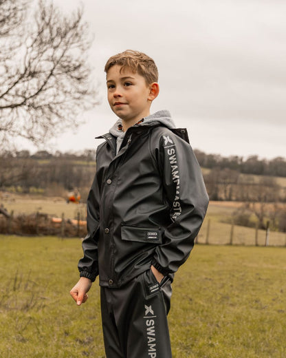 Navy Coloured Xpert Childrens Swampmaster Stormgear Waterproof Jacket on Outdoor Background
