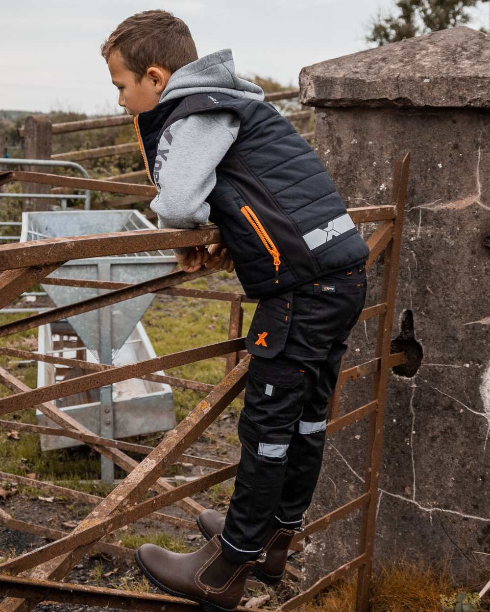 Black Coloured Xpert Children Pro Stretch Work Trousers on Outdoor Background