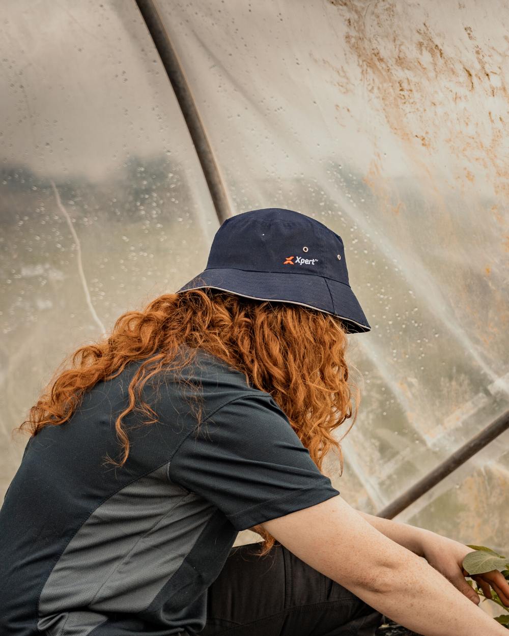 Navy Coloured Xpert Core Bucket Hat on Outdoor Background
