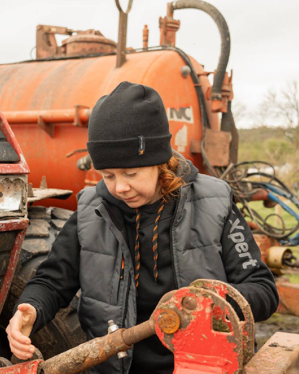 Black Coloured Xpert Core Thermal Lined Beanie Hat on Outdoor Background

