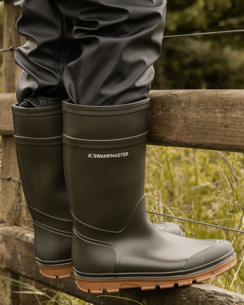 Green Coloured Xpert Kids Swampmaster Stampede Junior Wellingtons on Outdoor Background
