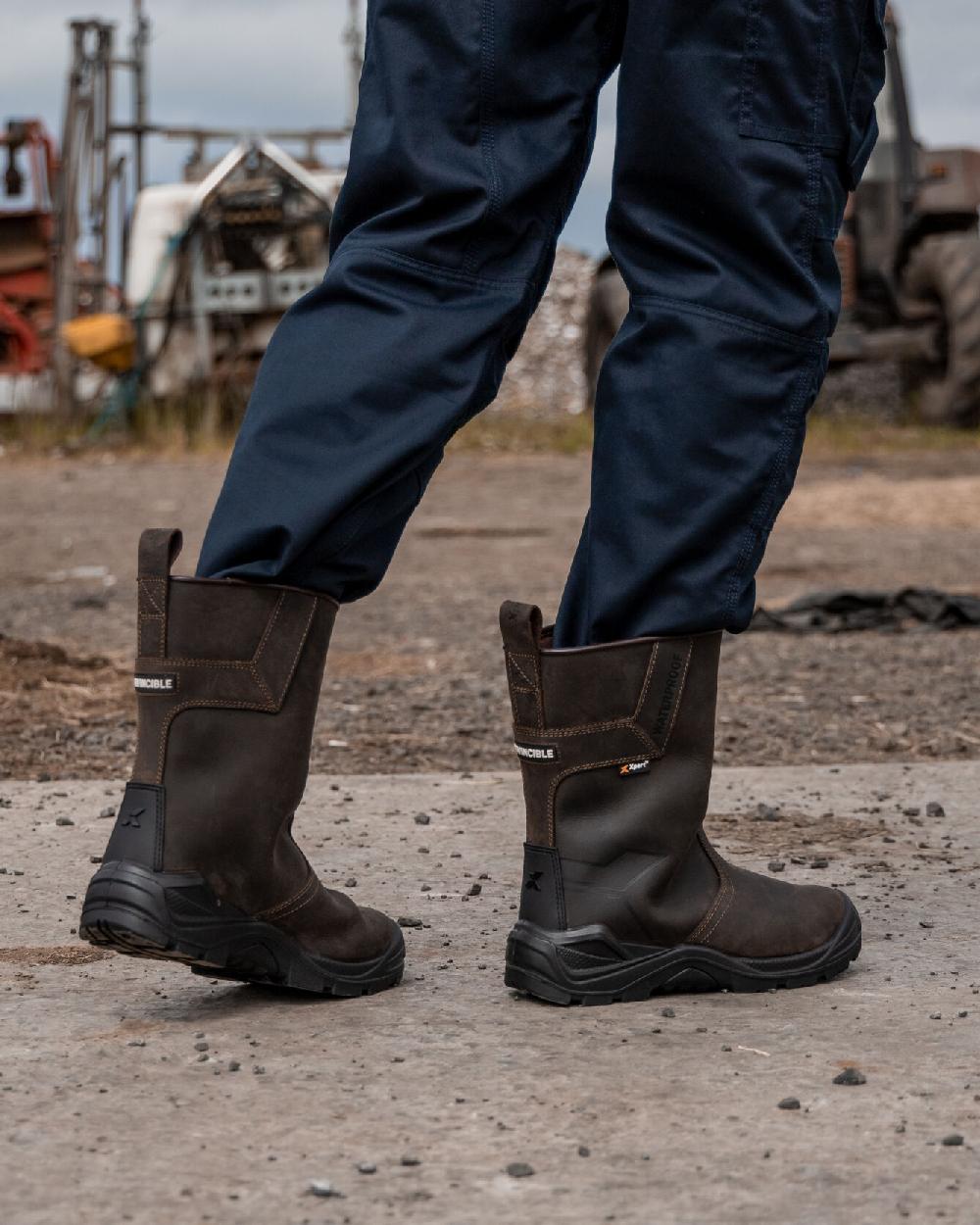 Brown Coloured Xpert Mens Invincible S3 Safety Waterproof Rigger Boots on Outdoor Background
