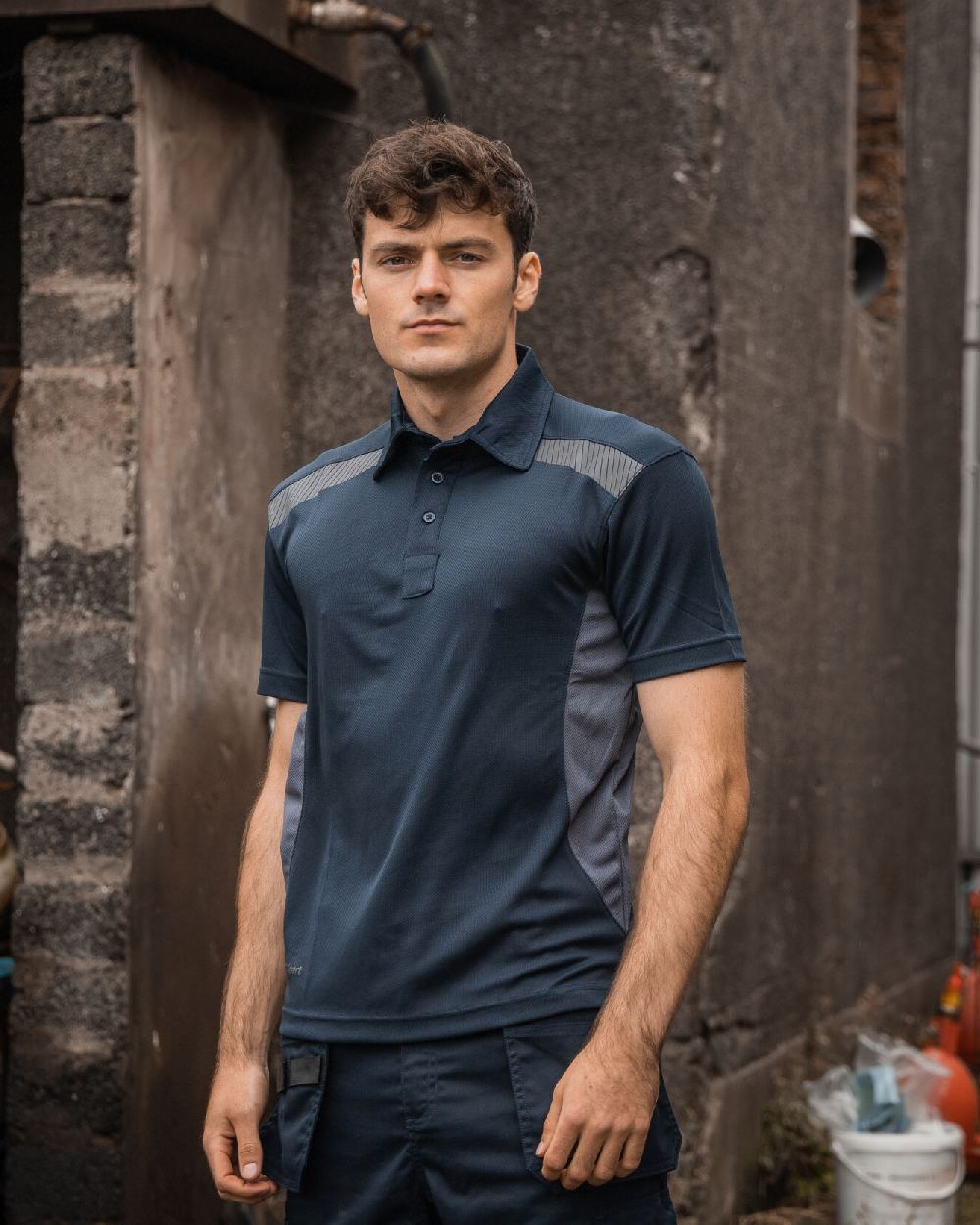Navy Grey Coloured Xpert Mens Pro Stretch Polo Shirt on Outdoor Background
