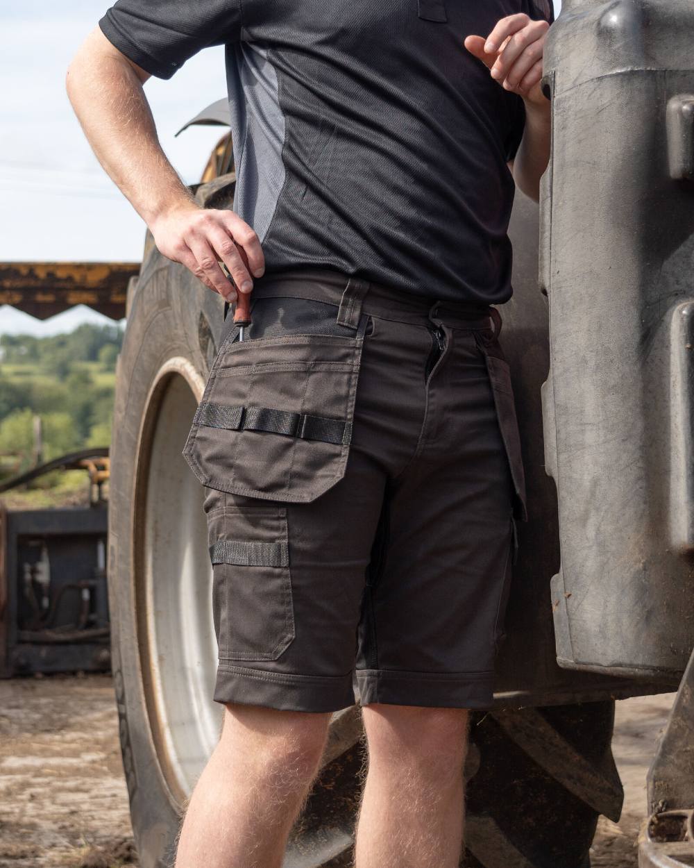 Grey Black Coloured Xpert Mens Pro Stretch Work Shorts on Outdoor Background
