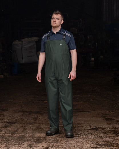 Green Coloured Xpert Mens Swampmaster No-Sweat Stormgear Waterproof Bib &amp; Brace on Indoor Background
