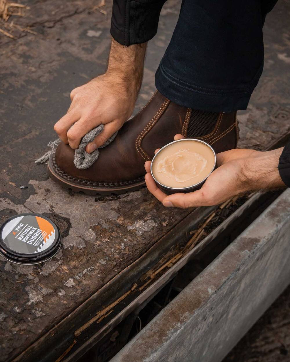 Neutral Coloured Xpert Pro-Wax Natural Beeswax Boots Dubbin on Outdoor Background
