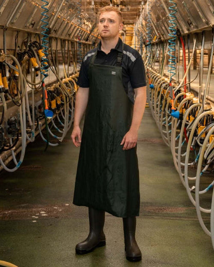 Green Coloured Xpert Swampmaster No-Sweat Stormgear Waterproof Dairy Apron on Factory Background
