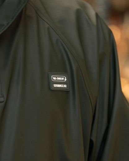 Green Coloured Xpert Swampmaster No-Sweat Stormgear Waterproof Dairy Gown on Factory Background
