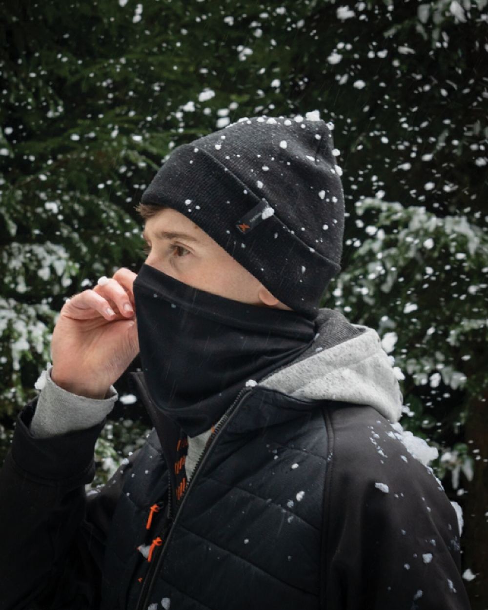 Black Coloured Xpert Winter Essentials Set Socks, Hat &amp; Snood on Snow Background
