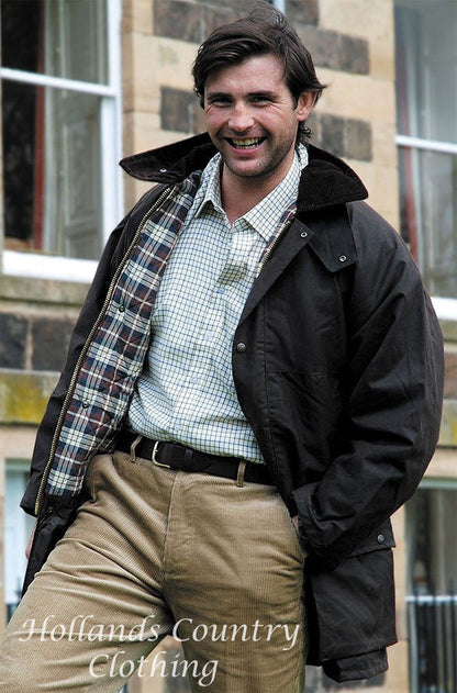 man wearing The Hoggs of Fife Padded Waxed Jacket in brown